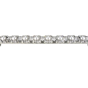 May include: A silver drawer pull with a row of white pearl-like embellishments.