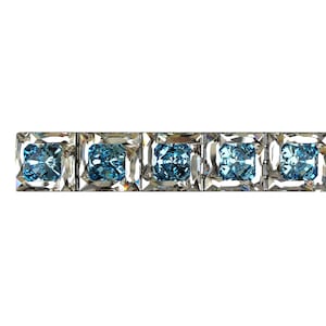 May include: A row of six square-shaped blue gemstones set in silver.
