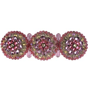 Puede incluir: Tres pinzas para el pelo redondas florales de color rosa y dorado con adornos de cristal.