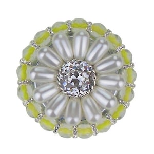 May include: A yellow and white beaded brooch with a pearl flower design and a clear crystal center.