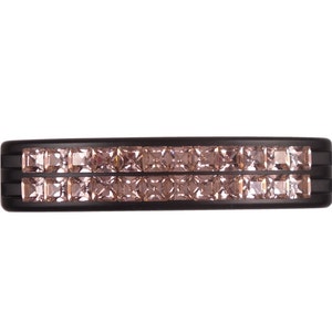 May include: A black ring with two rows of small, square-shaped, light pink gemstones.