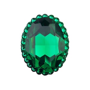 May include: An oval-shaped, emerald green gemstone with a scalloped border. The gem is faceted, reflecting light and creating a sparkling effect. The border is made up of small, round, green stones, enhancing the overall design.