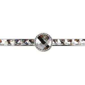 May include: A silver drawer pull with a crystal knob. The knob is surrounded by a ring of smaller crystals.