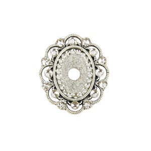May include: Silver oval-shaped pendant with a decorative border of clear rhinestones. The pendant has a hole in the center.