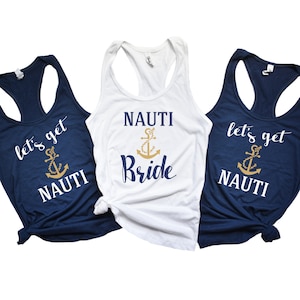 May include: Three tank tops with a nautical theme. One white tank top says "Nauti Bride" with a gold anchor. Two navy blue tank tops say "Let's get Nauti" with a gold anchor.