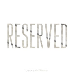 May include: A silver metallic text graphic that reads "RESERVED" on a white background.
