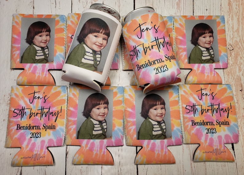 May include: A collection of personalized can coolers with a tie-dye background in shades of pink, orange, and blue. Each cooler features a photo of a person and the text "Jen's 50th birthday! Benidorm, Spain 2023."