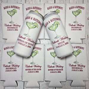 May include: White can coolers and beverage cans with a margarita design. The text on the coolers and cans reads "MARGS & MATRIMONY" and "Culbreth Wedding JAMAICA 2024" with various wedding party roles.