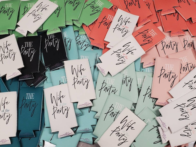 May include: A pile of colorful can coolers with the text "Wife of the Party" and "The Party" printed on them.