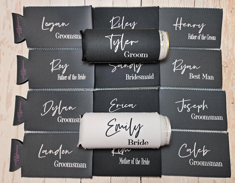 May include: Twelve black and white can coolers with names and titles printed on them. The names include Logan, Riley, Tyler, Sandy, Henry, Ryan, Dylan, Erica, Emily, Joseph, Landon, and Caleb.