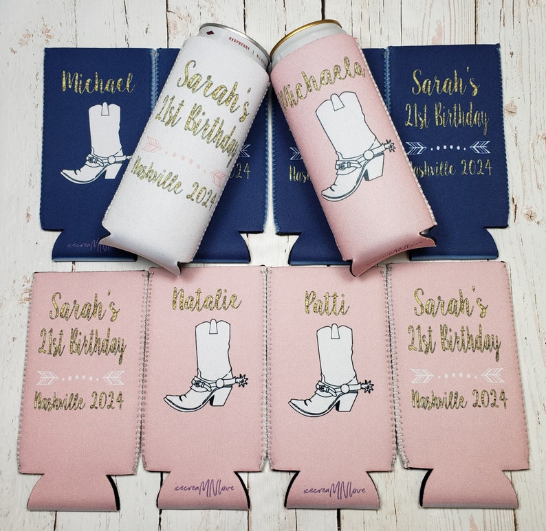 May include: Six pink and white can coolers with a gold glitter design. The coolers feature a cowboy boot design and the text "Sarah's 21st Birthday" and "Nashville 2024".