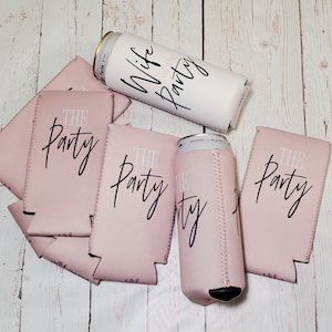 May include: Six pink and white can coolers with the text "The Party" printed on them. One white can cooler with the text "Wife of the Party" printed on it.