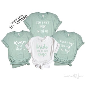 May include: Four t-shirts with different sayings about wine. The shirts are light green and white. The sayings are "wine girl wasted", "you can't sip with us", "bride on cloud wine", and "when I sip you sip we sip".