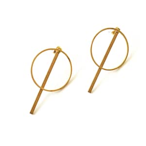 May include: A pair of gold-toned earrings with a circle and a straight line design.