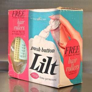 May include: A vintage box of Lilt Foam Home Permanent with a free offer of 36 plastic hair rollers. The box is pink, blue, and white with the words 'push button Lilt' and 'FREE hair rollers' printed on it. The box also features a picture of a woman's hand holding a bottle of Lilt Foam Home Permanent.