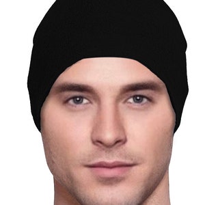 May include: A black knit beanie hat.