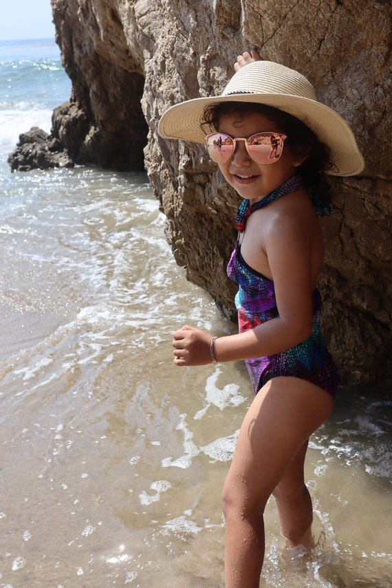 Boy in girl's one piece cheap swimsuit