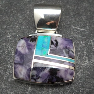 Handmade Sterling Silver Pendant with purple bertrandite, turquoise and man made Opal Inlay by Navajo Artist Kenneth Bitsie.