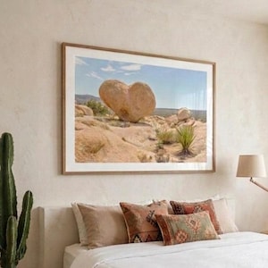 May include: A set of three ceramic mugs with a speckled, cream-colored glaze. Each mug features a different hand-painted floral design in shades of blue, green, and yellow. The mugs have a simple, rounded shape and a comfortable handle.