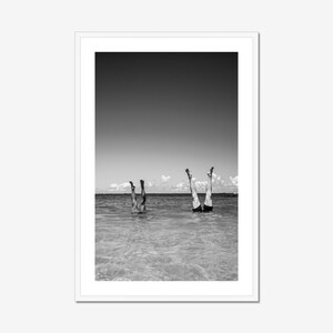 Black and white vertical coastal beach house print in minimalist white frame, perfect for coastal grandmother wall art style.