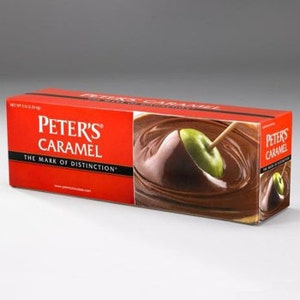 May include: A rectangular red box of Peter's Caramel. The box features the brand name and tagline, along with an image of a green apple being dipped in caramel. The net weight is 5.6 oz (159 g).