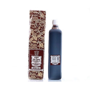 May include: A tall, dark blue bottle of liquid coffee extract next to a matching box. The box is brown with a floral pattern and text that reads "EXTRAIT CAFÉ LIQUIDE TRABLIT". The bottle contains 1 liter of coffee extract.