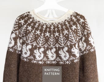 May include: A brown and white knit jumper featuring a circular yoke with a repeating pattern of white squirrels, pine trees, and stars against a brown background. The jumper has a cream-coloured ribbed neckline and the text KNITTING PATTERN.