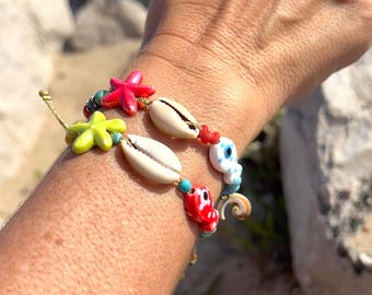 Braccialetto da spiaggia boho fatto a mano: conchiglia naturale, pesce in ceramica e stella marina