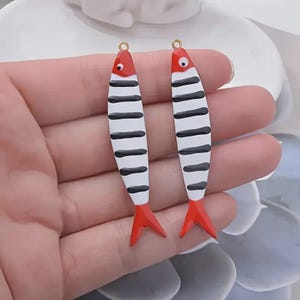 Enamel sardine charm inspired by Portuguese coast with black stripes