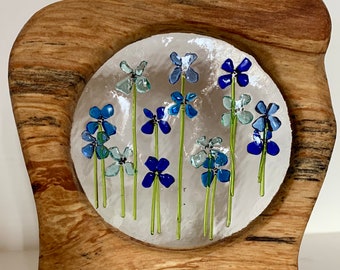 Blue flowers in wood