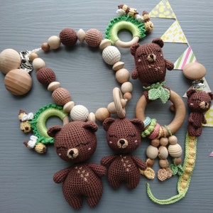 Bear themed baby gift set. Crochet toys bundle: pacifier clip, rattle, stuffed animal, stroller chain. Gender-neutral first birthday gift