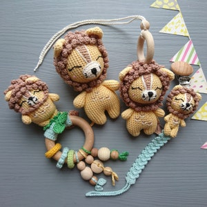 Lion themed baby gift set. Crochet toys bundle: pacifier clip, rattle, stuffed animal, hanging toy. Gender-neutral first birthday gift