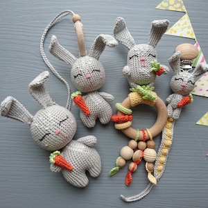 Bunny-themed baby gift set. Crochet toys bundle: pacifier clip, rattle, stuffed animal, hanging toy. Gender-neutral first birthday gift
