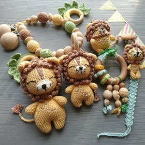Lion themed baby gift set. Crochet toys bundle: pacifier clip, rattle, stuffed animal, stroller chain. Gender-neutral first birthday gift