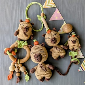 Baby gift set - Capybara themed. Crochet toys bundle: pacifier clip, rattle, hanging toy, stuffed animal. Gender-neutral first birthday gift