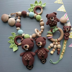 Beaver themed baby gift set. Crochet toys bundle: pacifier clip, rattle, stuffed animal, stroller chain. Gender-neutral first birthday gift