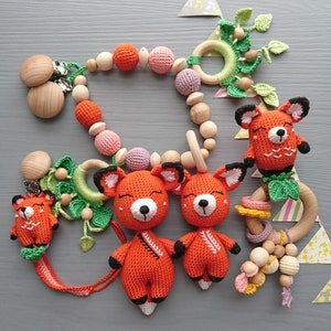 Fox themed baby gift set. Crochet toys bundle: pacifier clip, rattle, stuffed animal, stroller chain. Gender-neutral first birthday gift