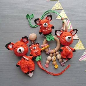 Fox themed baby gift set. Crochet toys bundle: pacifier clip, rattle, stuffed animal, hanging toy. Gender-neutral first birthday gift