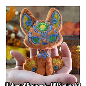 May include: A DIY sewing kit for making a plush toy wolf with a brown, orange, and green embroidered design. The kit includes all the materials needed to create a cute and cuddly wolf.