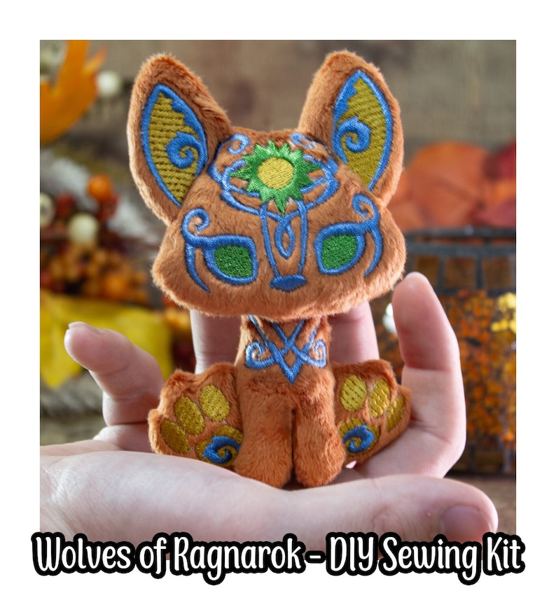 May include: A DIY sewing kit for making a plush toy wolf with a brown, orange, and green embroidered design. The kit includes all the materials needed to create a cute and cuddly wolf.