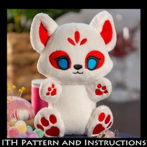 May include: White plush fox with red accents. The fox has blue eyes and a red nose. The fox is sitting with its paws in front of it.