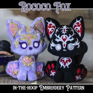 Puede incluir: Dos juguetes de peluche de zorro, uno morado con bordado dorado y otro negro con bordado plateado. Ambos tienen corazones rojos y diseños intrincados. El texto "Rococo Fox" y "Patrón de bordado en el aro" es visible.