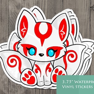 May include: Three 3.75 inch waterproof vinyl stickers featuring a white fox with red markings and blue eyes. The fox is sitting with its tail curled around its body. The stickers are perfect for adding a touch of whimsy to laptops, water bottles, or other surfaces.