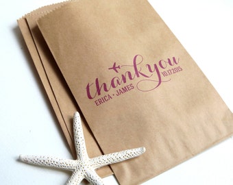 May include: Brown paper favor bags with a pink thank you message, a small airplane icon, and the text "Erica + James 10.17.2015".
