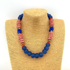 Red, white, and blue African glass  with antique African brass and bone necklace