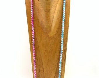 Hot pink and teal-splattered glass beaded long necklace