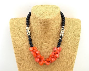 Salmon orange coral necklace with cheetah spot bone beads