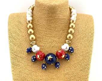 Red, white, and blue vintage lucite with gold stars with dangling charms and gold wood necklace