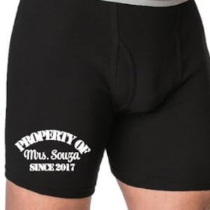 May include: Black boxer briefs with the text "PROPERTY OF Mrs. Souza SINCE 2017" in white.
