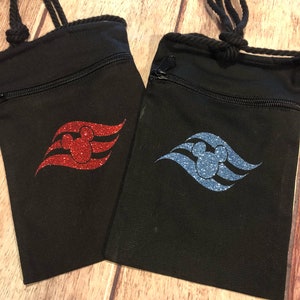 May include: Two black drawstring bags with a zipper closure. Each bag features a Disney Cruise Line logo with a Mickey Mouse head in the center. One bag has a red glitter logo and the other has a blue glitter logo.